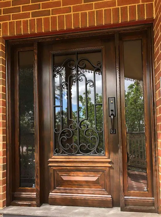 A Glass and Wooden Detailed Main Door for a House